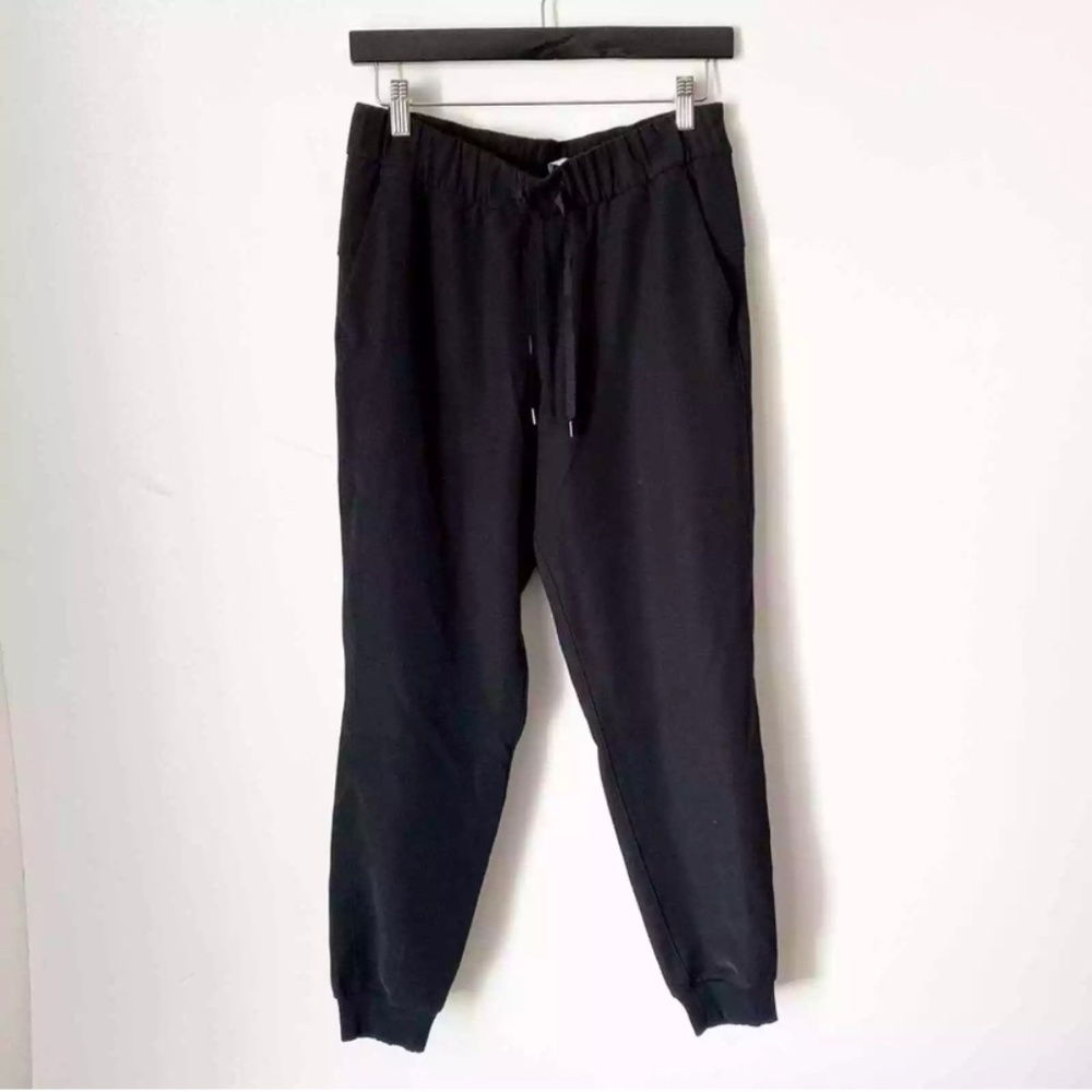 Lululemon On The Fly black jogger woven drawstring waist pocket pants size 6
